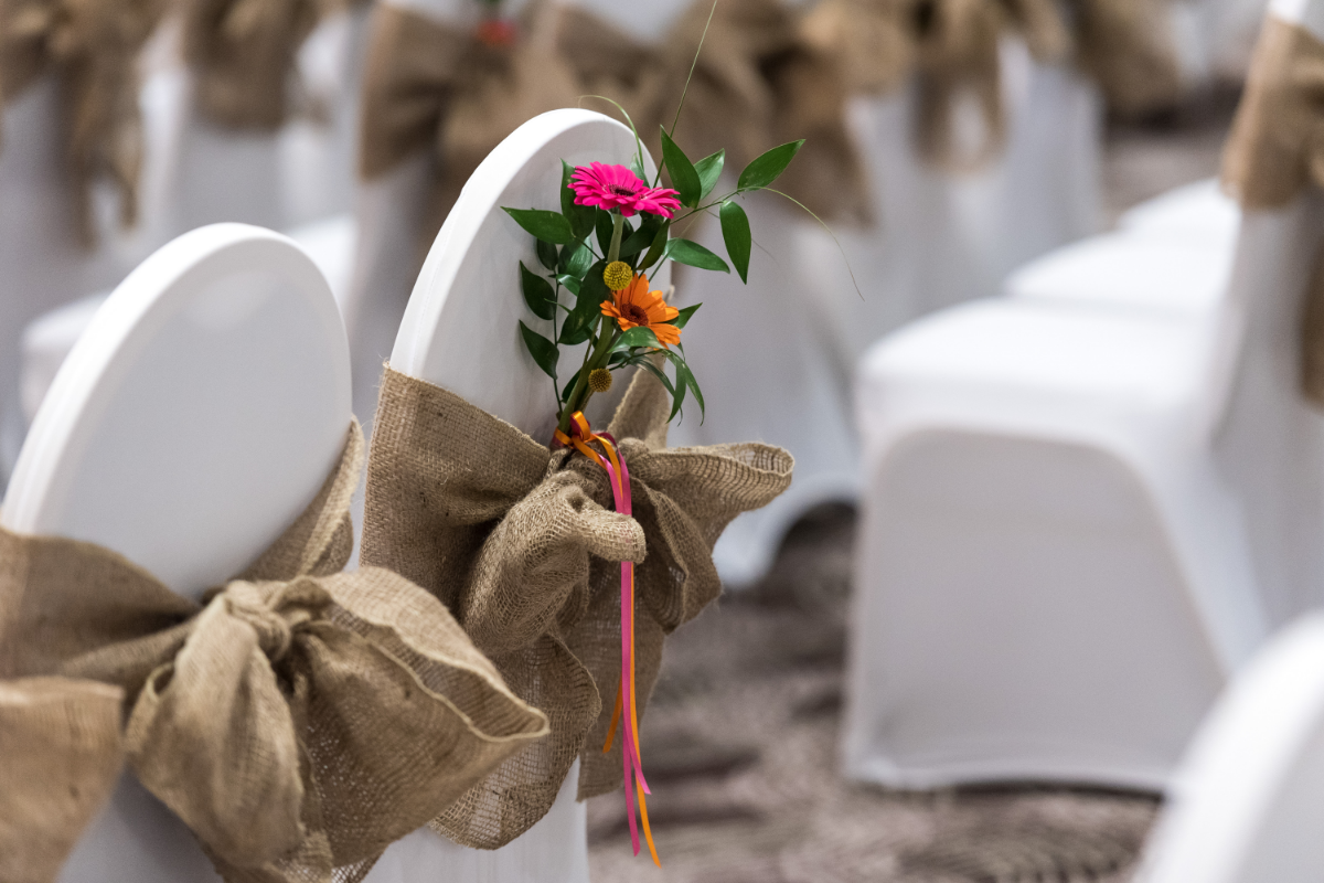 chair covers, brown fabric with flowers tied in